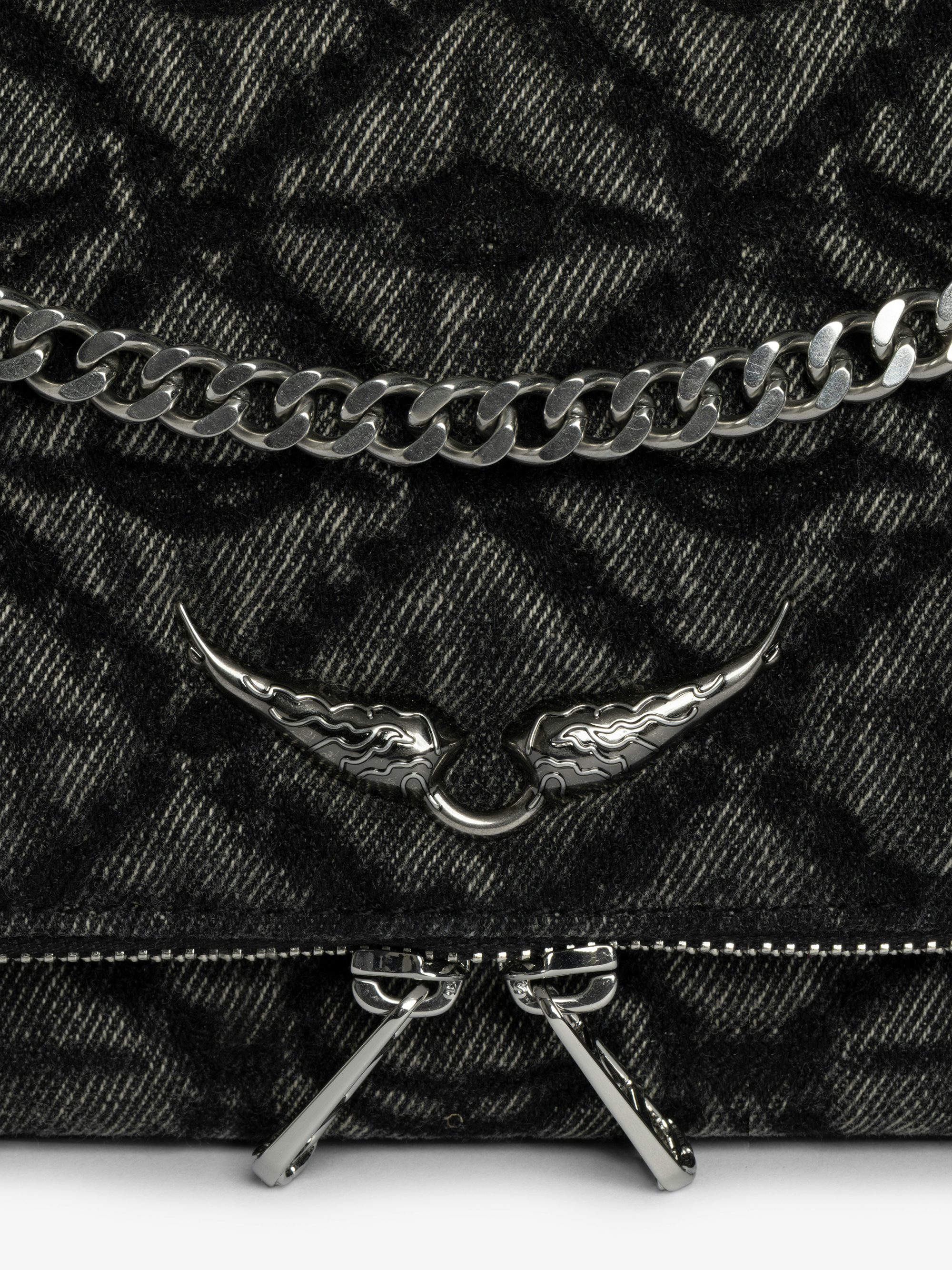 Rock II Monogram Clutch - Clutch in denim with sliding metal chain and signature wings.